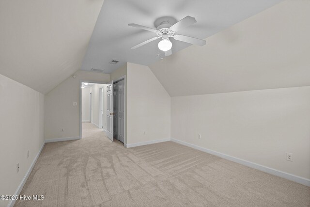 123 S Park Ln, Newport, NC 28570 - bonus room with light carpet, lofted ceiling, baseboards, and a ceiling fan