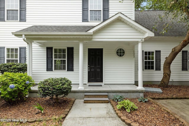 123 S Park Ln, Newport, NC 28570 - entrance to property featuring a porch, roof with shingles, and a chimney