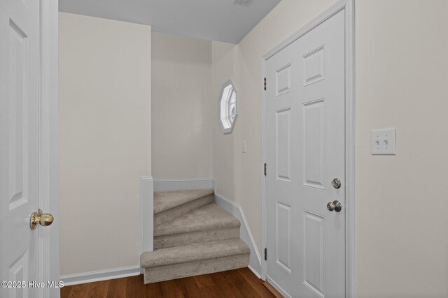 123 S Park Ln, Newport, NC 28570 - entryway with baseboards, dark wood-style floors, and stairway