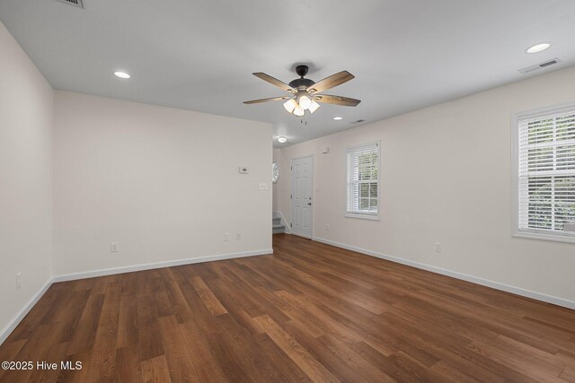 123 S Park Ln, Newport, NC 28570 - unfurnished room with wood finished floors, ceiling fan, baseboards, recessed lighting, and stairway