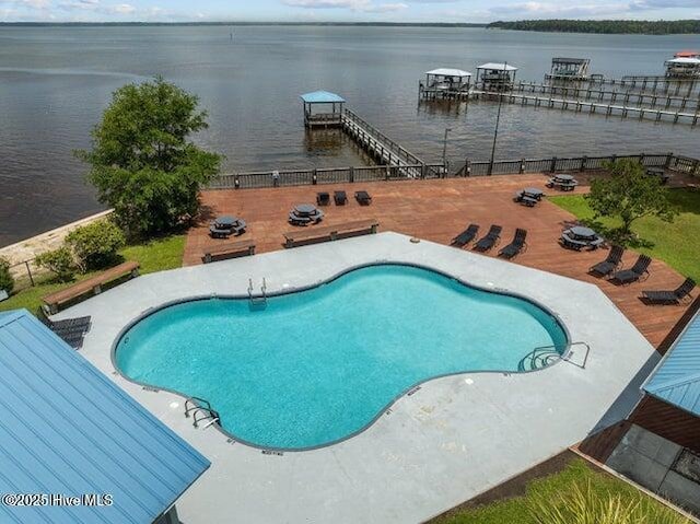 604 Willbrook Cir, Sneads Ferry, NC 28460 - view of swimming pool with a water view and a patio