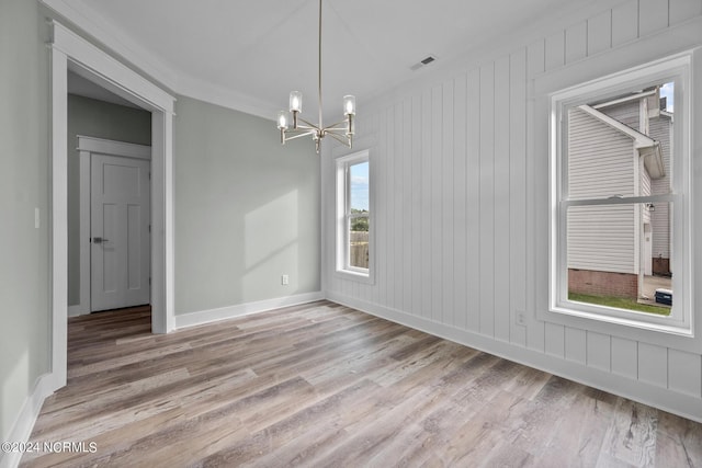 604 Willbrook Cir, Sneads Ferry, NC 28460 - empty room with a chandelier, light wood-style floors, and baseboards