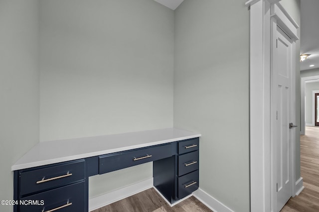 604 Willbrook Cir, Sneads Ferry, NC 28460 - unfurnished office with dark wood-type flooring, built in study area, and baseboards