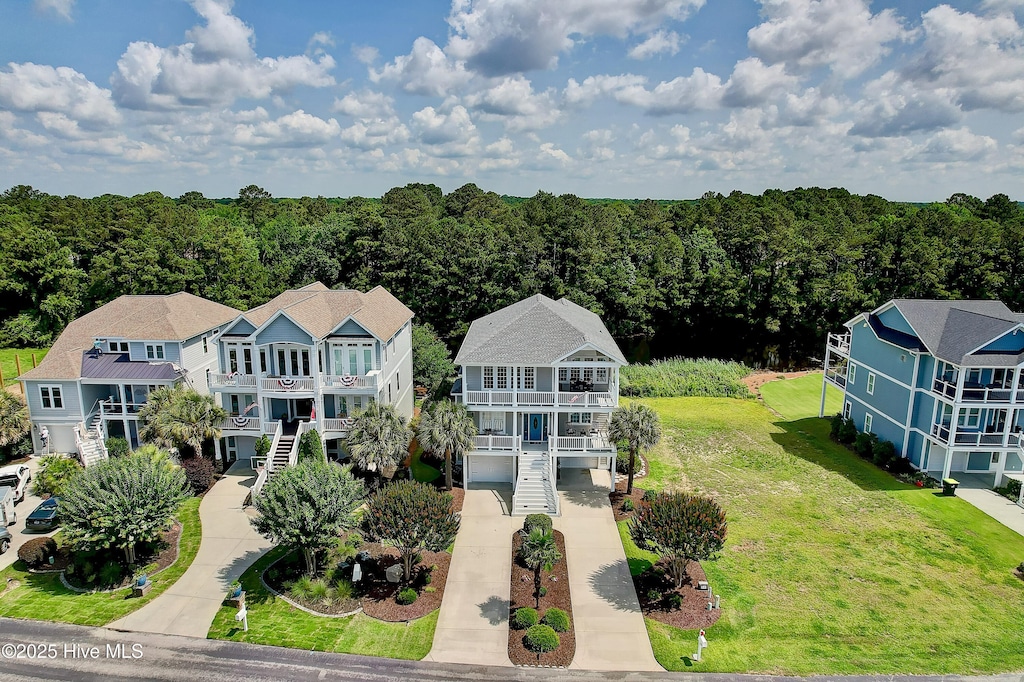 2820 Harborside Way, Southport, NC 28461 - aerial view of property and surrounding area with a heavily wooded area