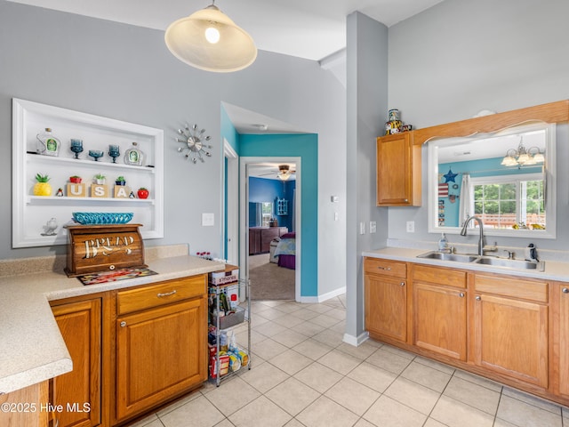 102 Sand Ct, Jacksonville, NC 28546 - kitchen with a sink, light countertops, open shelves, and light tile patterned flooring