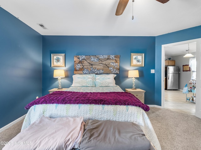 102 Sand Ct, Jacksonville, NC 28546 - bedroom with freestanding refrigerator, carpet, baseboards, and a ceiling fan