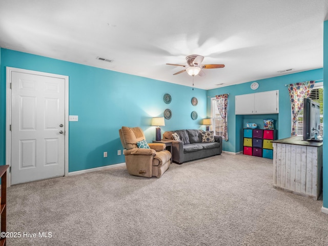 102 Sand Ct, Jacksonville, NC 28546 - carpeted living room featuring ceiling fan and baseboards