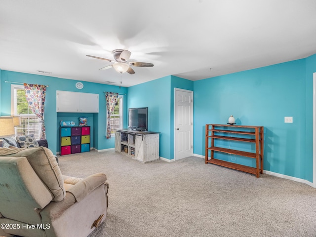 102 Sand Ct, Jacksonville, NC 28546 - carpeted living area featuring healthy amount of natural light, ceiling fan, and baseboards