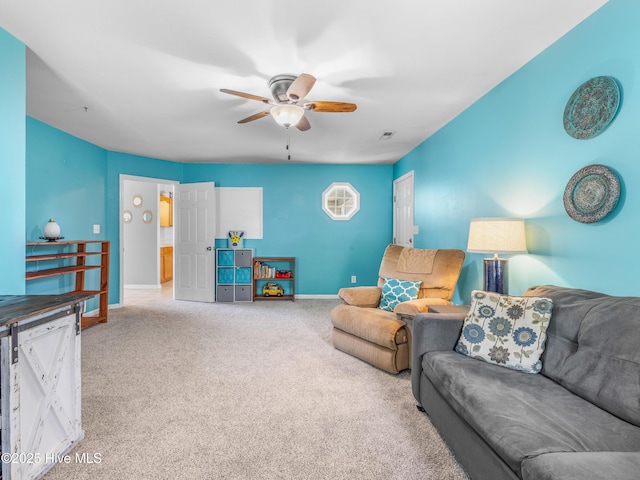 102 Sand Ct, Jacksonville, NC 28546 - living area with a ceiling fan, carpet floors, and baseboards