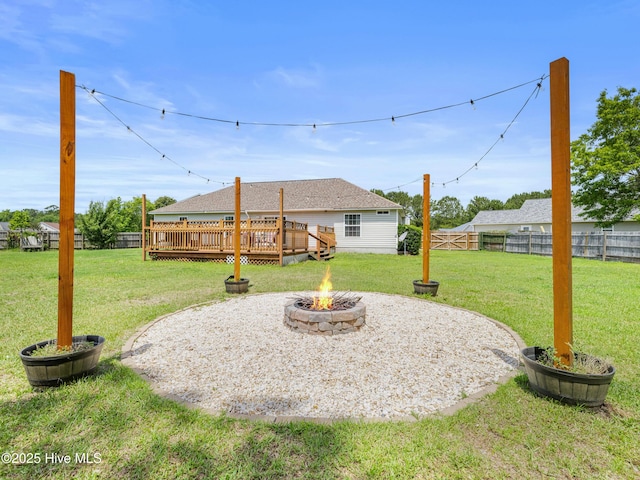 102 Sand Ct, Jacksonville, NC 28546 - view of yard featuring a fire pit and a wooden deck