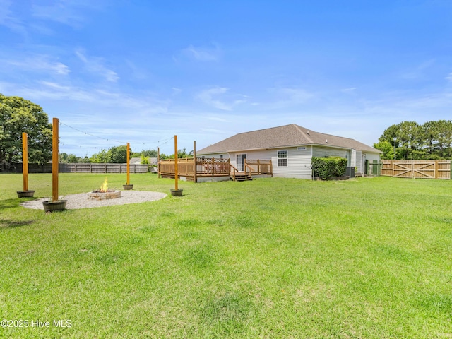 102 Sand Ct, Jacksonville, NC 28546 - view of yard with a fire pit, a deck, and central air condition unit