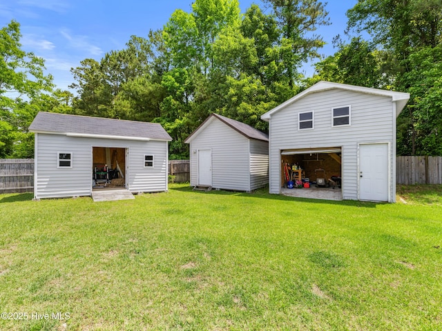 102 Sand Ct, Jacksonville, NC 28546 - view of yard with a garage and an outbuilding