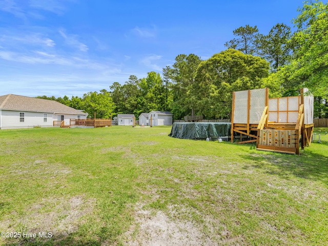 102 Sand Ct, Jacksonville, NC 28546 - view of grassy yard with view of scattered trees and a swimming pool