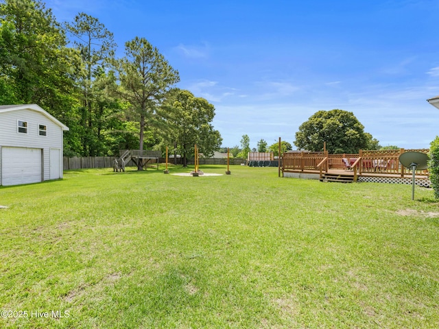 102 Sand Ct, Jacksonville, NC 28546 - view of yard featuring a deck and an outbuilding