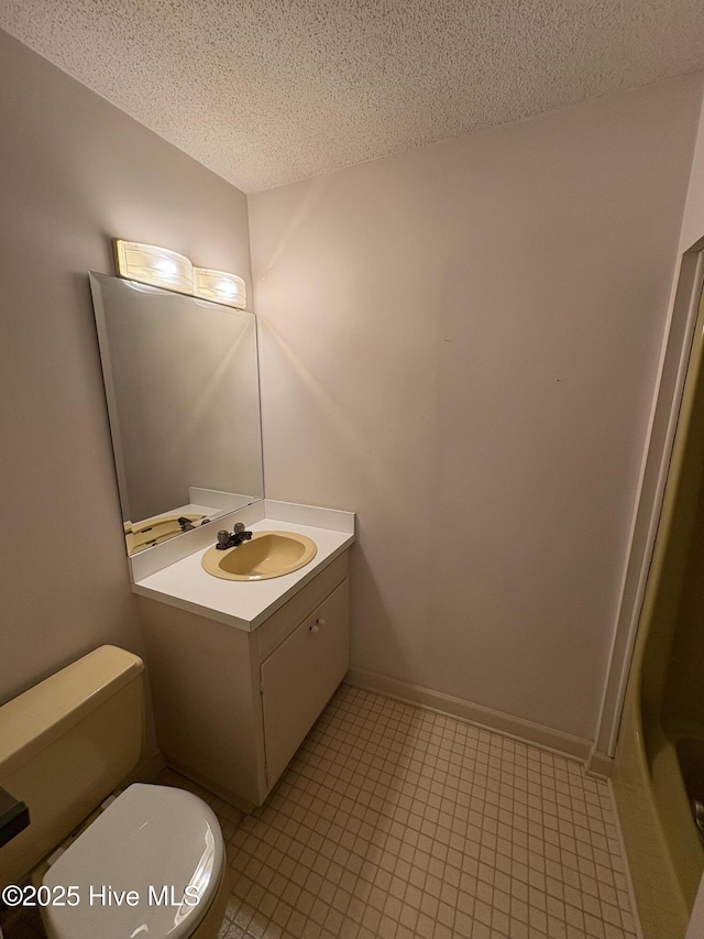 1608 Brices Creek Rd, New Bern, NC 28562 - bathroom featuring toilet, a textured ceiling, vanity, and tile patterned floors