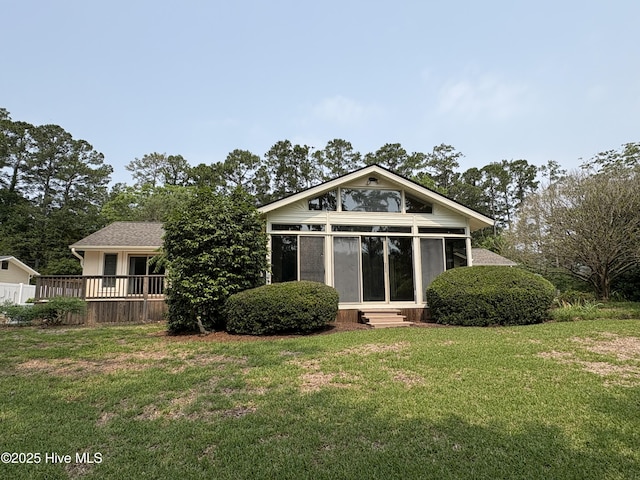 1608 Brices Creek Rd, New Bern, NC 28562 - back of house featuring a lawn, entry steps, a wooden deck, and a sunroom