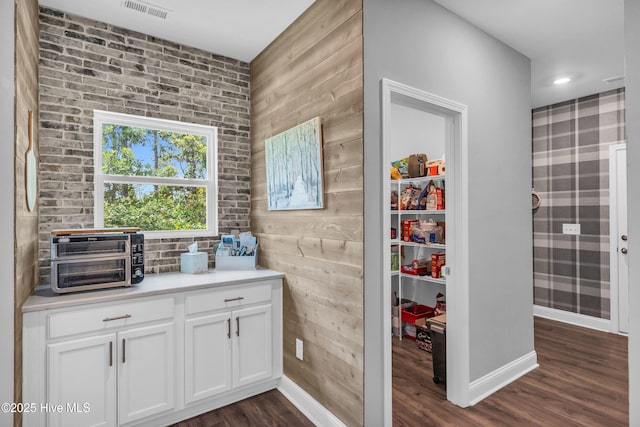 1700 Sun Palms Blvd SE, Bolivia, NC 28422 - bar featuring dark wood finished floors, baseboards, and wood walls