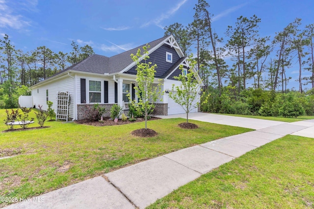 1700 Sun Palms Blvd SE, Bolivia, NC 28422 - view of front of property with driveway, a garage, a front lawn, and a shingled roof