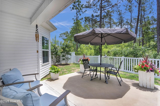 1700 Sun Palms Blvd SE, Bolivia, NC 28422 - fenced backyard featuring outdoor dining space and a patio area