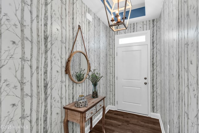 1700 Sun Palms Blvd SE, Bolivia, NC 28422 - foyer with a chandelier, wallpapered walls, wood finished floors, and baseboards