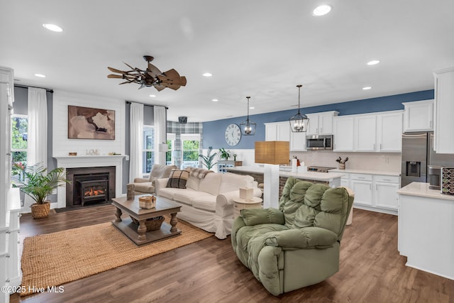 1700 Sun Palms Blvd SE, Bolivia, NC 28422 - living room with ceiling fan, recessed lighting, wood finished floors, and a large fireplace