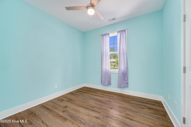 1858 E Boiling Spring Rd, Southport, NC 28461 - empty room featuring baseboards, wood finished floors, and a ceiling fan