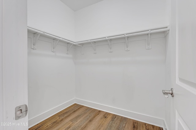 1858 E Boiling Spring Rd, Southport, NC 28461 - spacious closet featuring wood finished floors