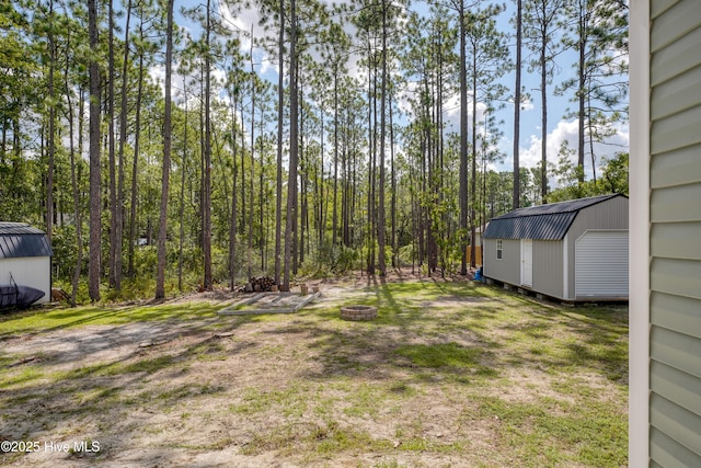 1858 E Boiling Spring Rd, Southport, NC 28461 - view of yard featuring an outdoor fire pit