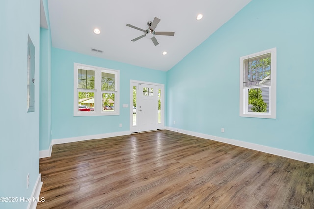 1858 E Boiling Spring Rd, Southport, NC 28461 - spare room featuring ceiling fan, wood finished floors, high vaulted ceiling, baseboards, and recessed lighting