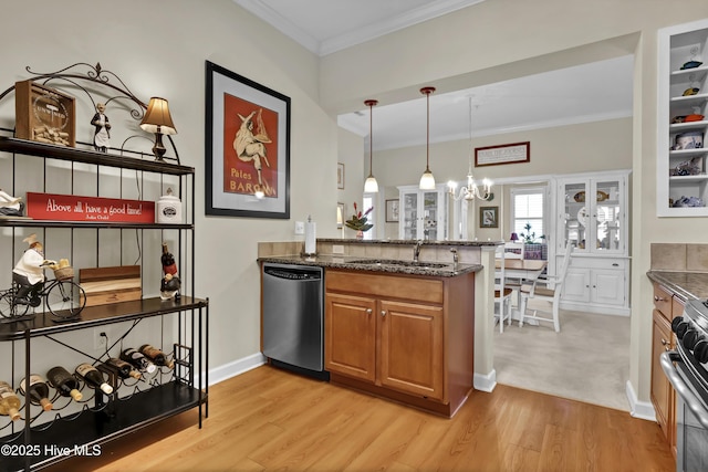 644 Village Park Dr Unit 207, Wilmington, NC 28405 - kitchen with appliances with stainless steel finishes, a sink, light wood-style flooring, brown cabinets, and a chandelier