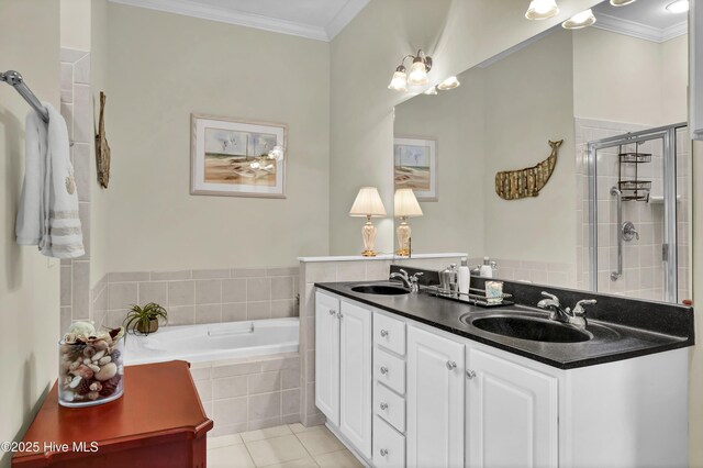 644 Village Park Dr Unit 207, Wilmington, NC 28405 - bathroom featuring double vanity, a bath, ornamental molding, tile patterned flooring, and a stall shower