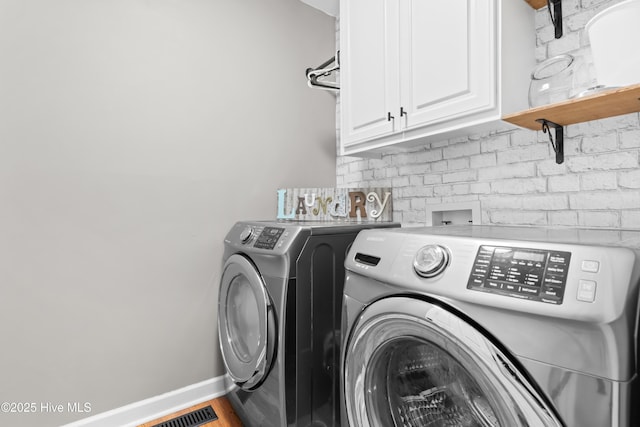 105 Teal Pointe Dr, Pikeville, NC 27863 - laundry room featuring washing machine and clothes dryer, cabinet space, and baseboards