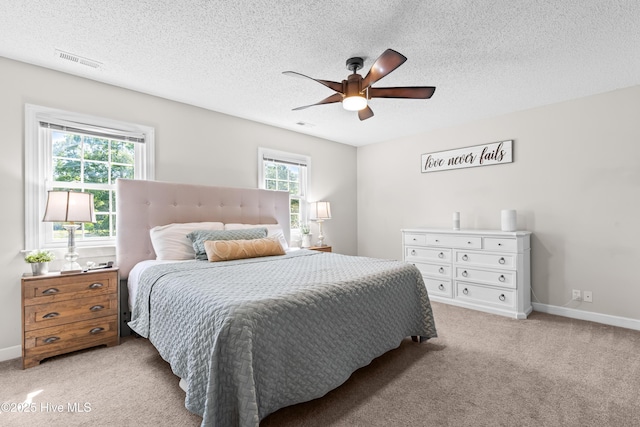 105 Teal Pointe Dr, Pikeville, NC 27863 - bedroom with light colored carpet, a textured ceiling, a ceiling fan, and baseboards