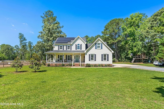 105 Teal Pointe Dr, Pikeville, NC 27863 - view of front facade featuring a porch, solar panels, and driveway