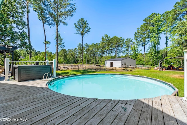 105 Teal Pointe Dr, Pikeville, NC 27863 - outdoor pool featuring a wooden deck and view of scattered trees