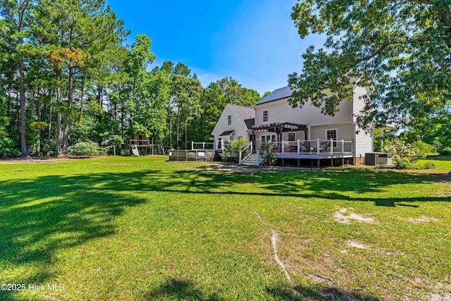 105 Teal Pointe Dr, Pikeville, NC 27863 - view of grassy yard featuring a pergola and a wooden deck
