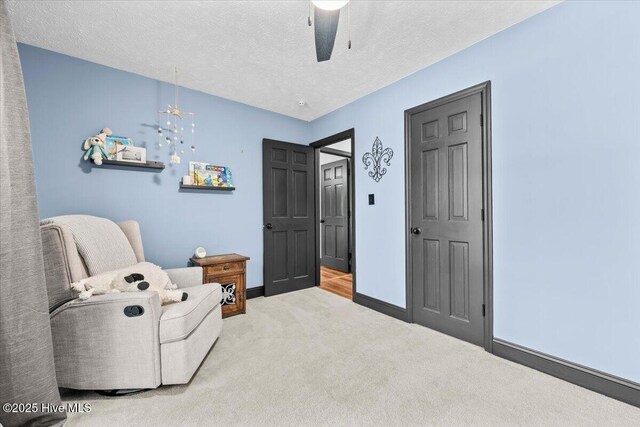 105 Tartan Trl, Southern Pines, NC 28387 - living area featuring carpet, a ceiling fan, and a textured ceiling