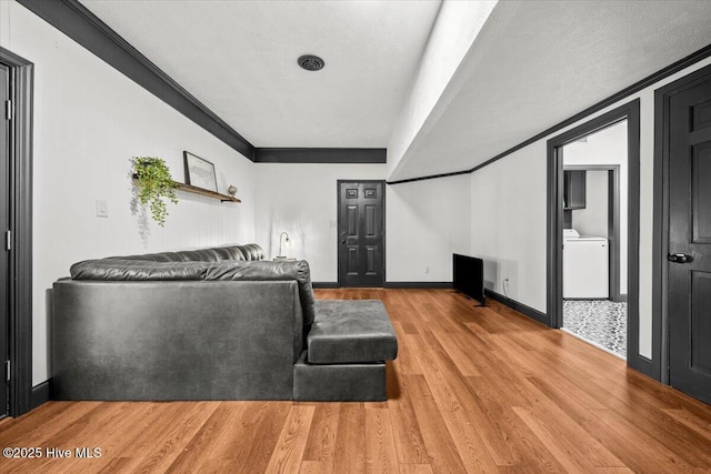 105 Tartan Trl, Southern Pines, NC 28387 - living room featuring washer / dryer and light wood-style floors
