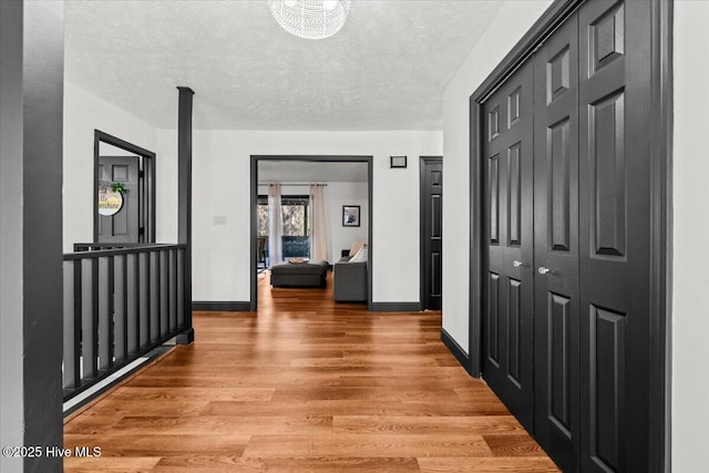 105 Tartan Trl, Southern Pines, NC 28387 - corridor featuring light wood-style flooring and a textured ceiling