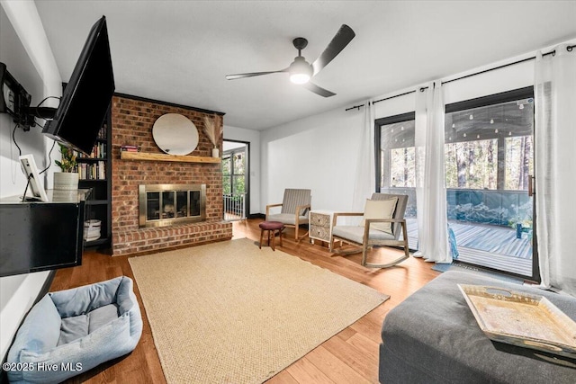 105 Tartan Trl, Southern Pines, NC 28387 - living area with ceiling fan, wood finished floors, and a fireplace