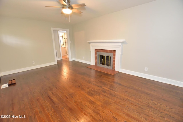 853 Burton St, Rocky Mount, NC 27803 - unfurnished living room featuring a ceiling fan, dark wood finished floors, a fireplace, and baseboards