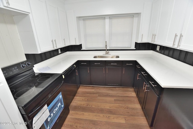 853 Burton St, Rocky Mount, NC 27803 - kitchen featuring black appliances, a sink, white cabinets, and wood finished floors