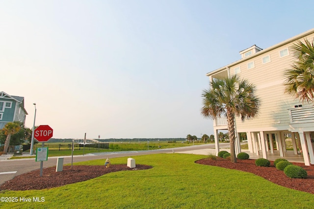 405 27th St Unit A, Sunset Beach, NC 28468 - view of home's community featuring a yard
