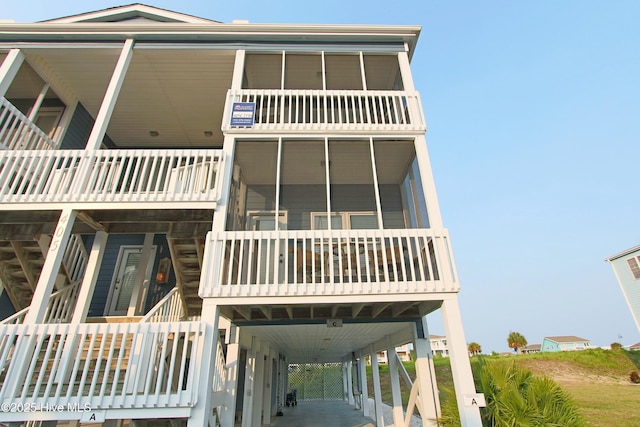 405 27th St Unit A, Sunset Beach, NC 28468 - view of front of property with a balcony