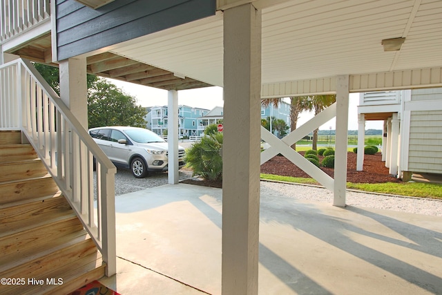 405 27th St Unit A, Sunset Beach, NC 28468 - view of patio featuring stairs