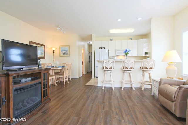 405 27th St Unit A, Sunset Beach, NC 28468 - living room with dark wood-type flooring, recessed lighting, and baseboards
