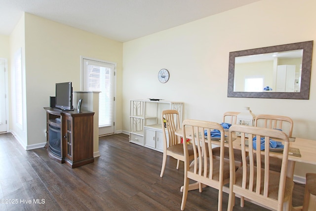405 27th St Unit A, Sunset Beach, NC 28468 - dining room with dark wood-style flooring and baseboards