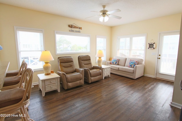 405 27th St Unit A, Sunset Beach, NC 28468 - living room with a ceiling fan, dark wood-style flooring, plenty of natural light, and baseboards
