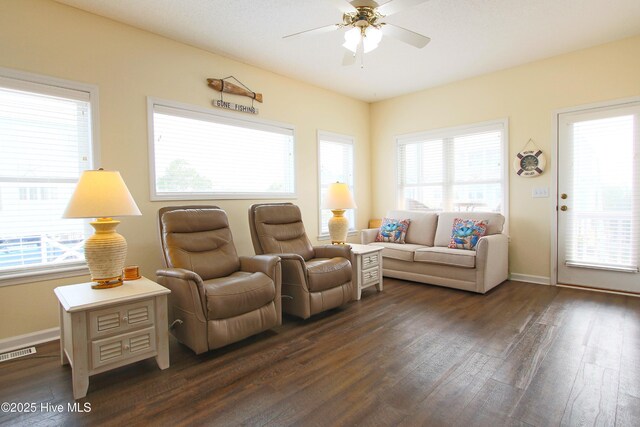 405 27th St Unit A, Sunset Beach, NC 28468 - living room with dark wood-style floors, ceiling fan, and healthy amount of natural light