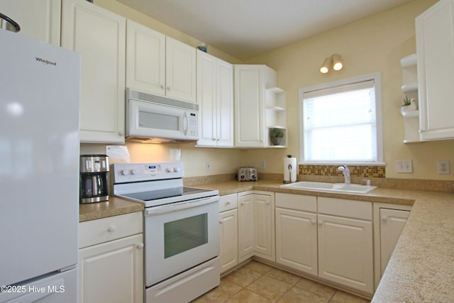 405 27th St Unit A, Sunset Beach, NC 28468 - kitchen with white appliances, open shelves, a sink, white cabinets, and light countertops